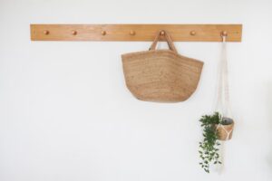 Brown bag hanging on a wooden hooks hanger